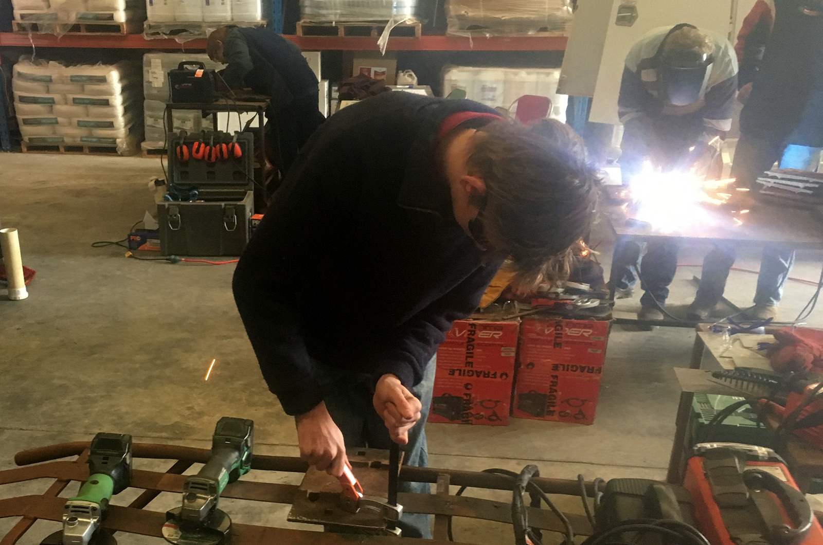 Students welding in the workshop