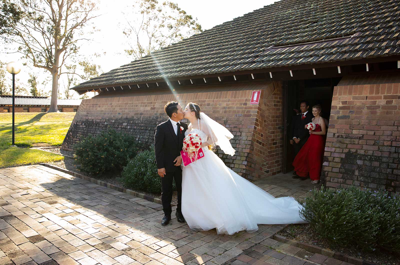 Bride and groom standing outside chapel