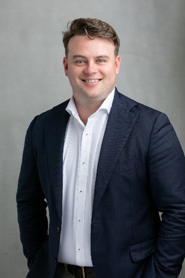 Photo of Josh in suit