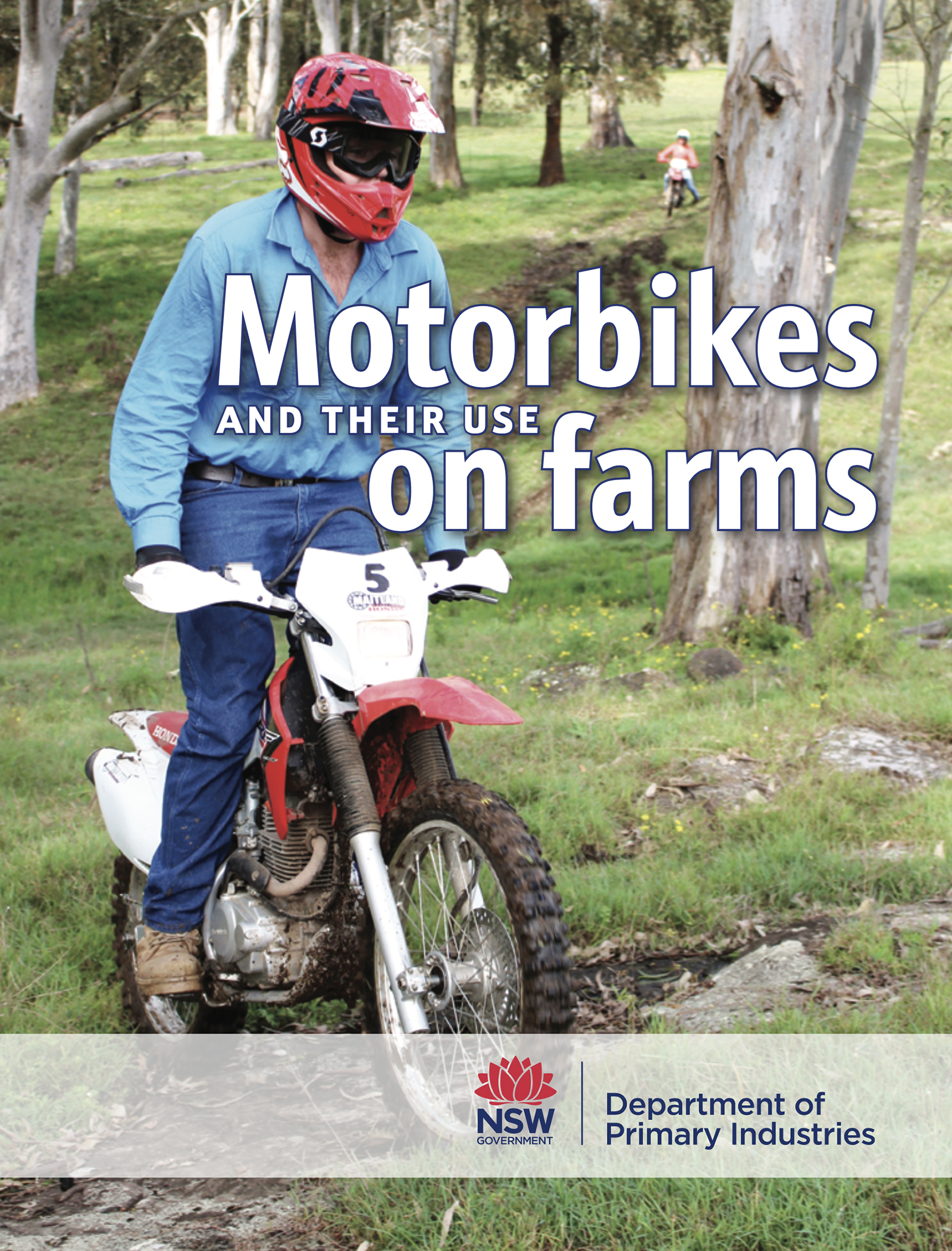 Cover of Motorbike book with image of male riding bike towards viewer, riding in a standing position